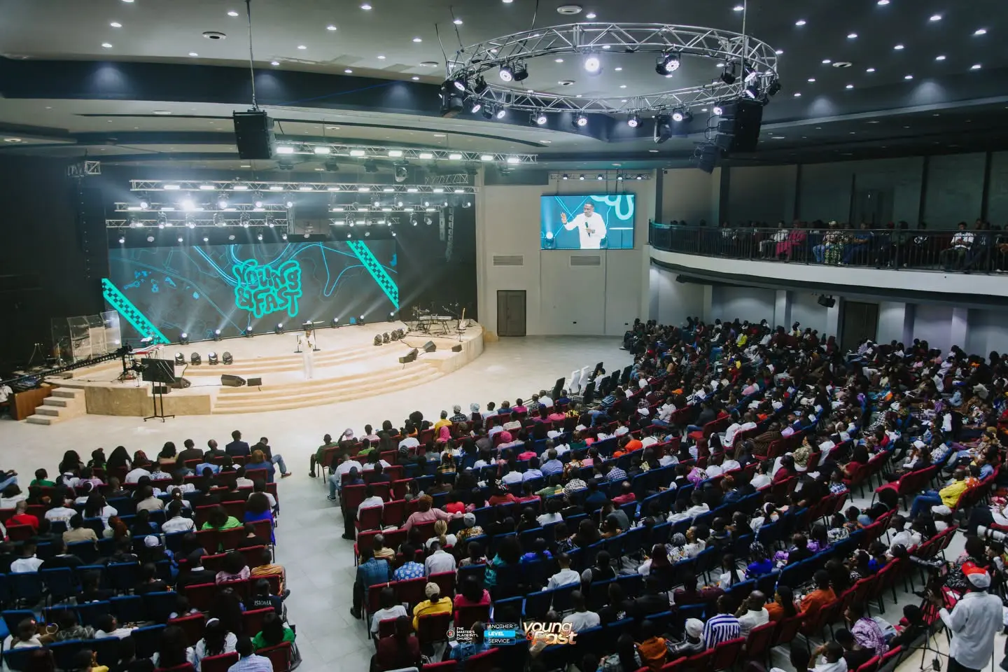 Church auditorium showing LED side screens and central stage display