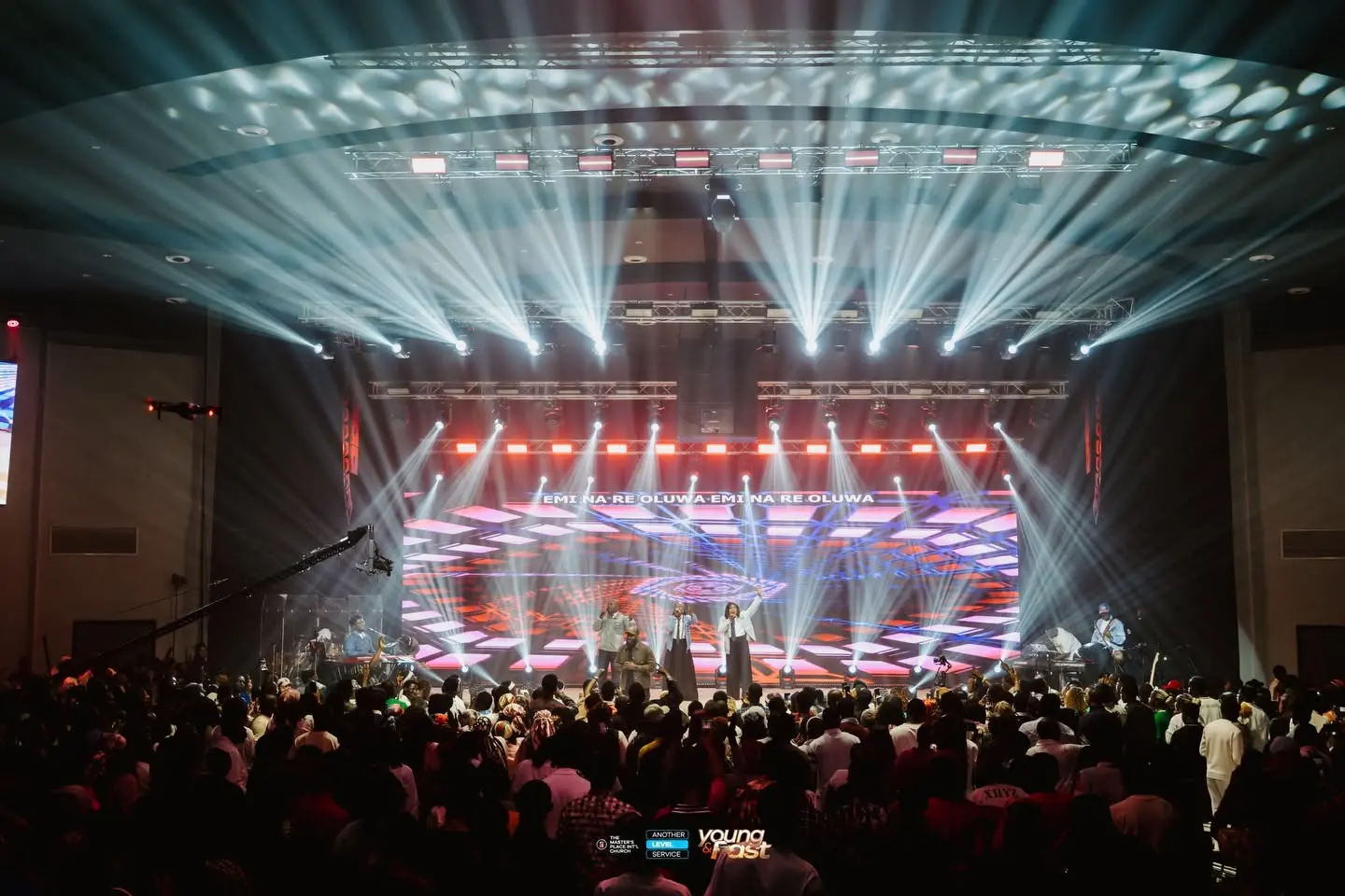 Concert production with wide LED wall and red stage lighting